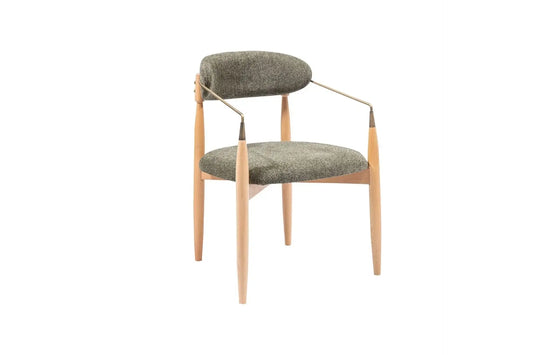 The Orion Designer Chair by Travertable features a modern design with a green cushioned backrest and seat, supported by light wood legs. Its metallic armrests curve outward slightly, offering ergonomic comfort while maintaining a sleek, contemporary look.