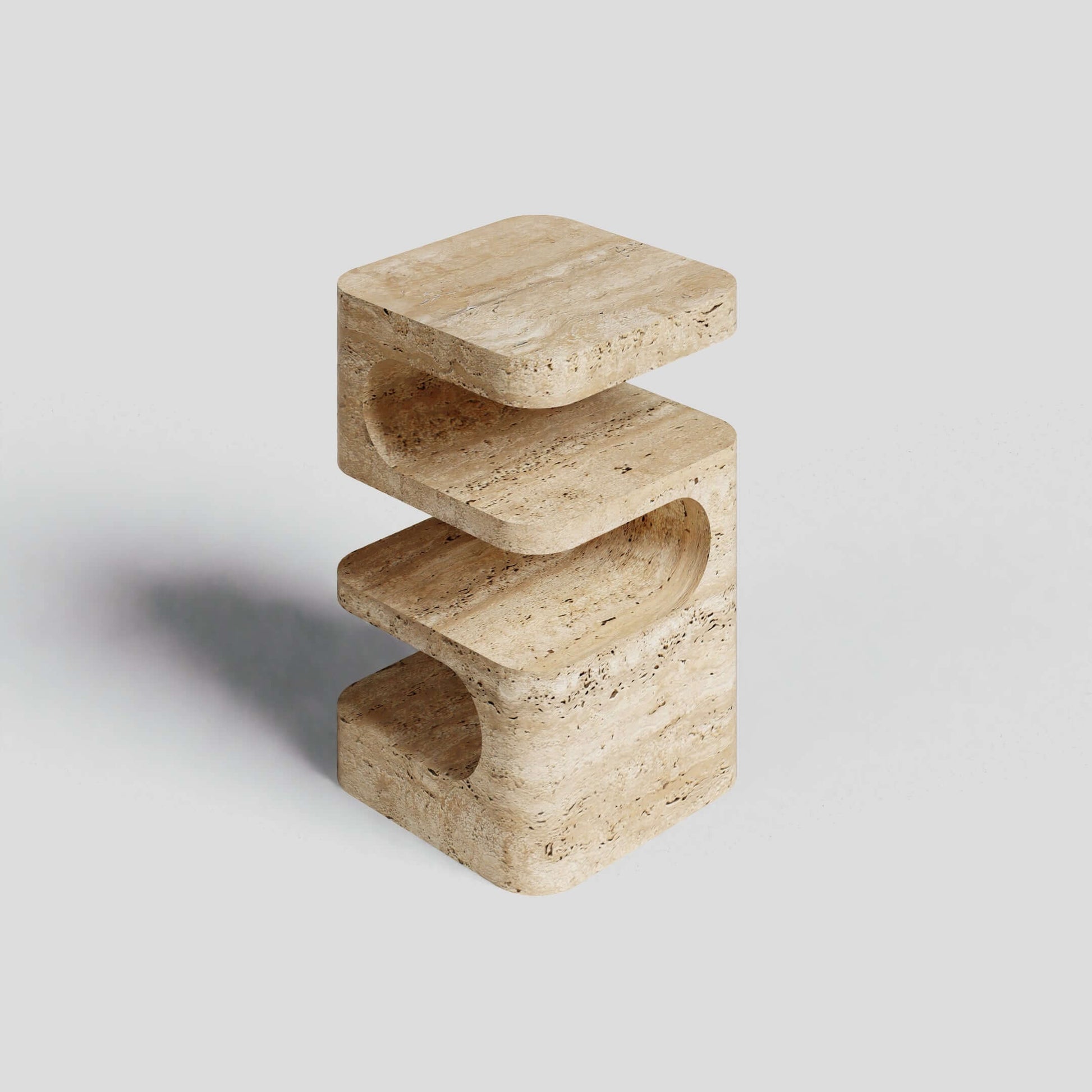 The Serenity Block Travertine Table by Travertable is a modern marvel, featuring a light brown sculptural design with three stacked, curved layers that highlight the charming textures of natural stone.